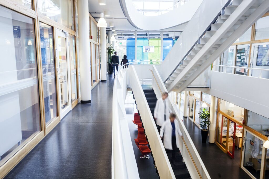 Doctors moving down steps in hospital